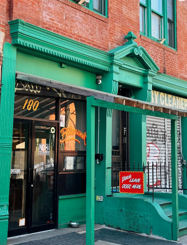 "Please leave dogs here" sign outside of store