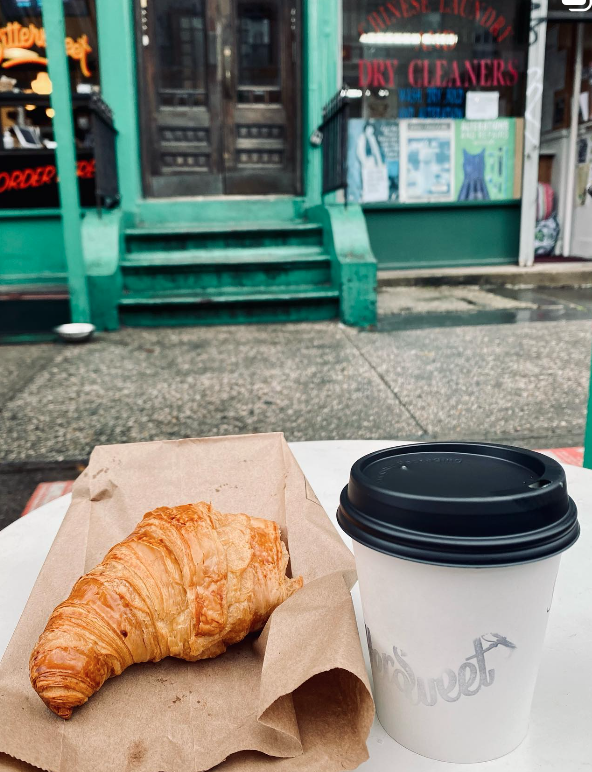 Croissant and coffee outside of store