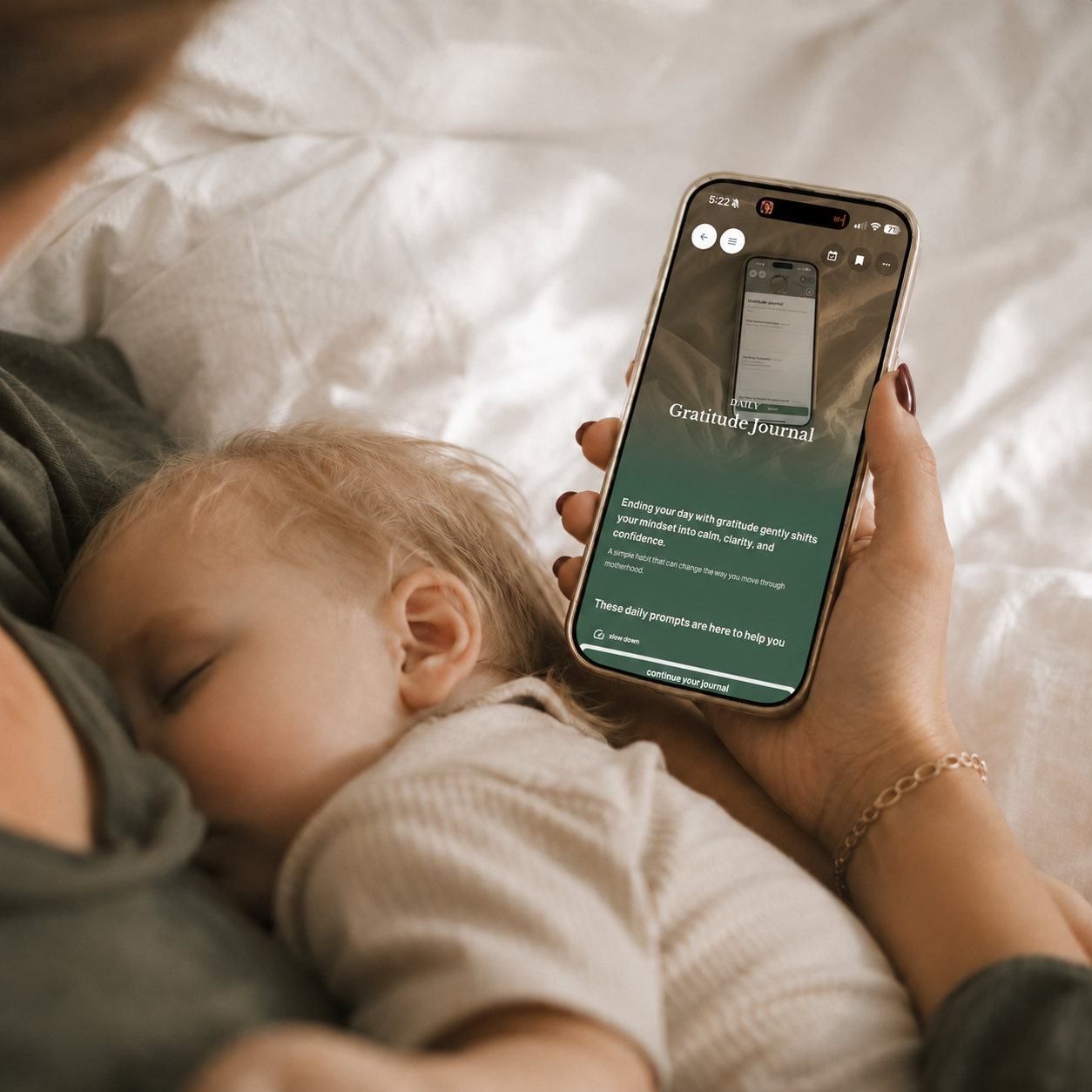 nap trapped mum with toddler, laying in bed calmly doing her gratitude journal to see the little beautiful moments inside her everyday motherhood routine.