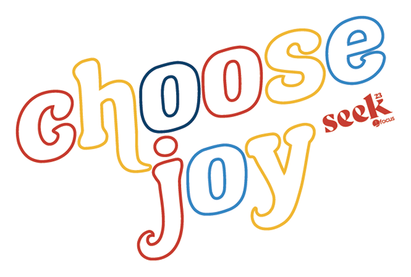 Colorful typographic design of the words "chocolate" and "joy" with the "seek" logo in the bottom right corner.