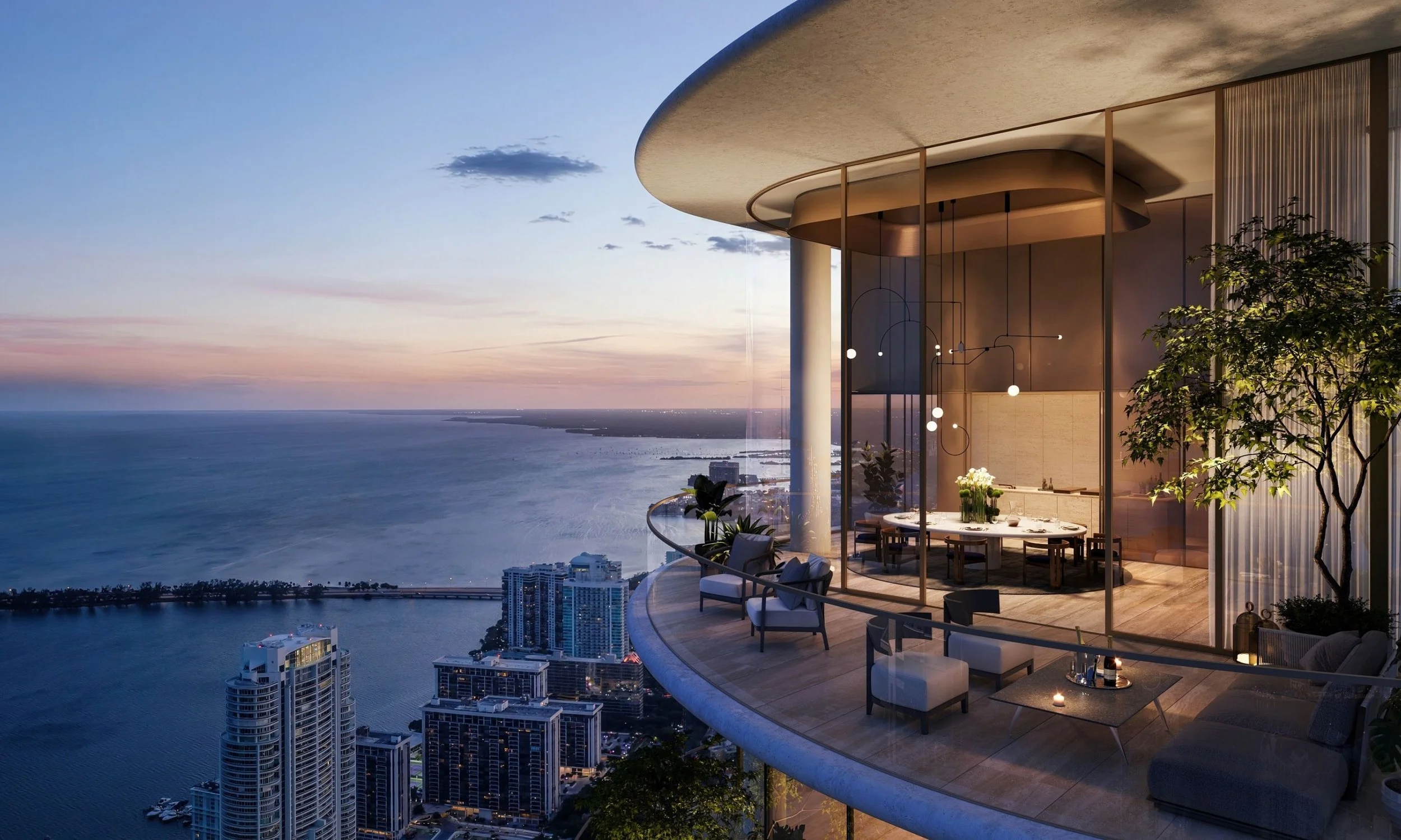 Luxury apartment balcony with modern furniture and city view at sunset.