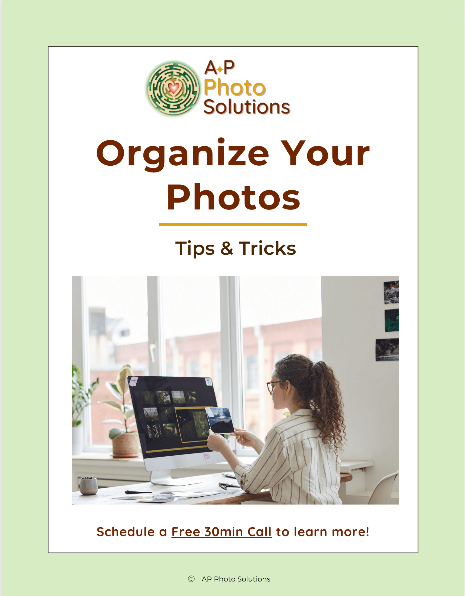 Free eBook cover titled "Organize Your Photos: Tips & Tricks" from AP Photo Solutions, showing a woman organizing digital photos on a computer at home office desk.