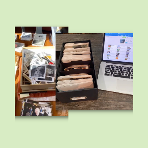 A desktop setup with a variety of unorganized printed photographs on the left, and a computer screen with a photo organization interface on the right, along with a black photo box showing photo mess to organization.