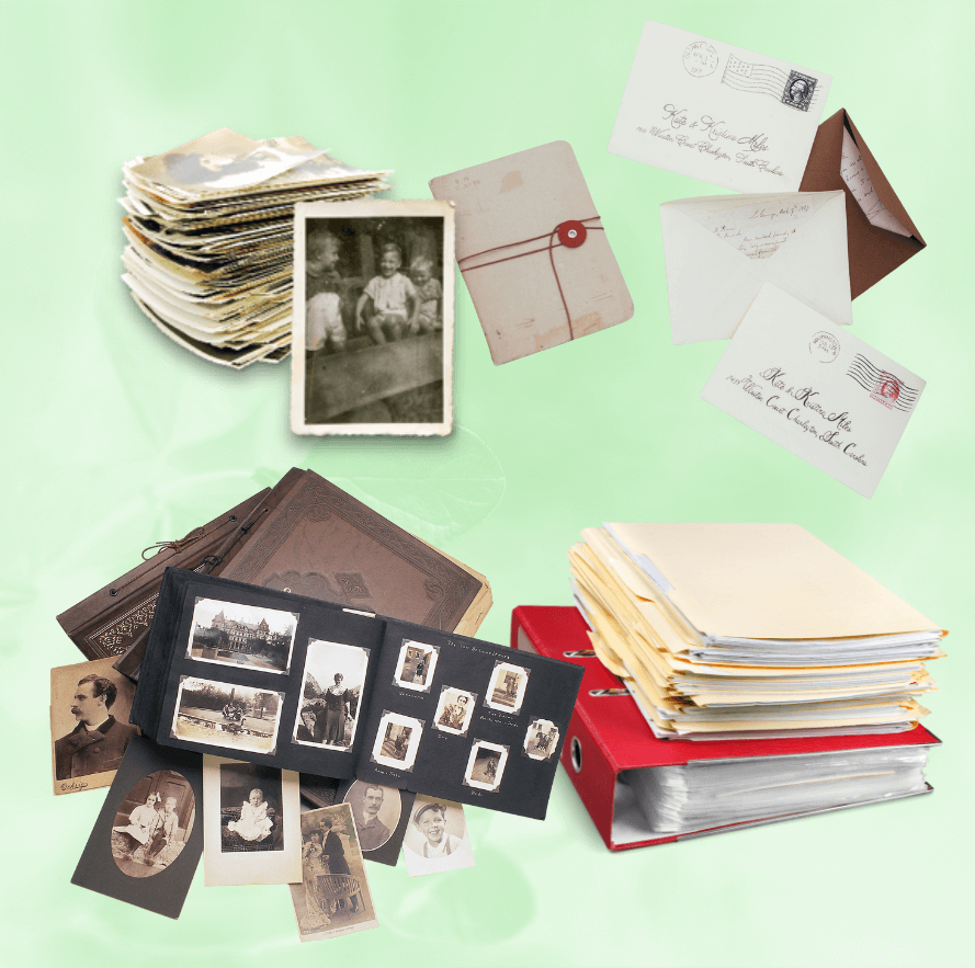Photo of vintage photographs, albums, letters, and documents stacked and organized, representing scanning services for prints and memorabilia.