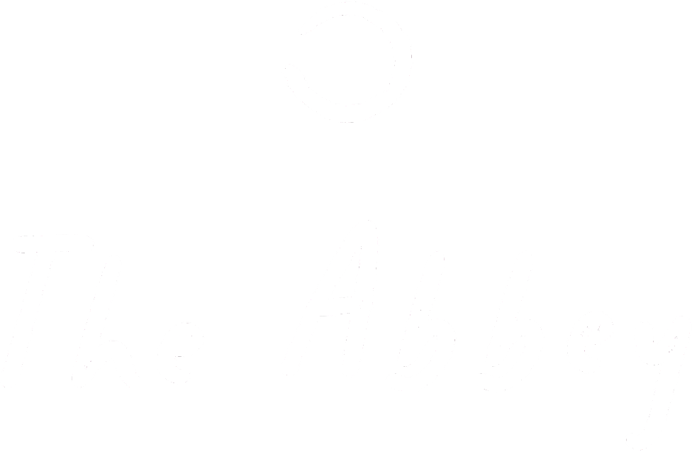 Black background with white handwritten text that says "The Abbey" and a simple illustration of a coiled line at the top.
