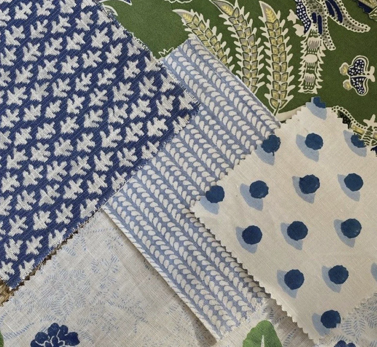 Multiple fabric swatches with various blue, white, and green patterns, including geometric, floral, and polka dot designs.