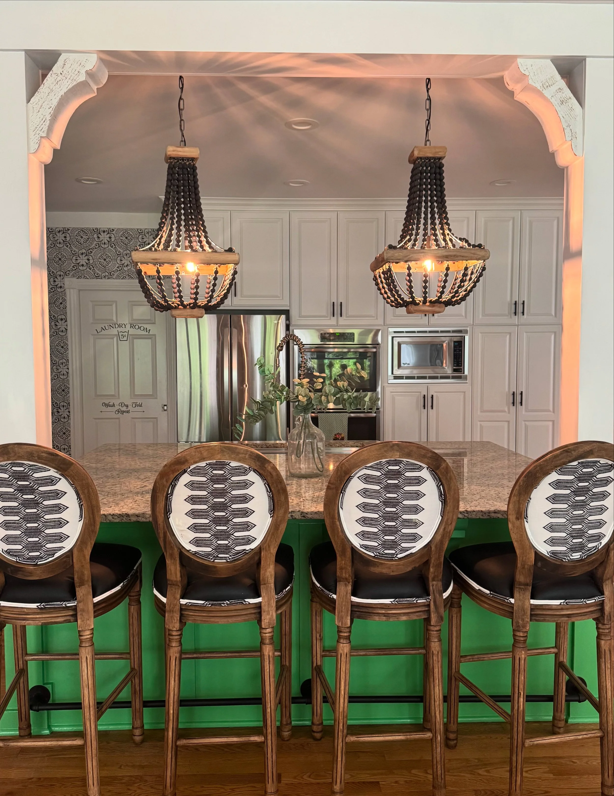 Black & White kitchen with a pop of green