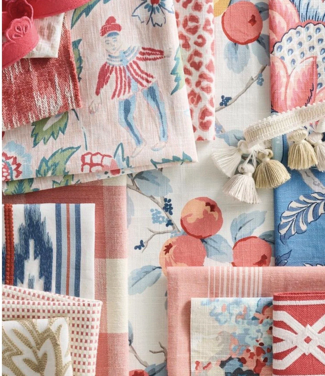 A collection of fabric swatches with floral, striped, and patterned designs in pink, red, blue, and cream colors.