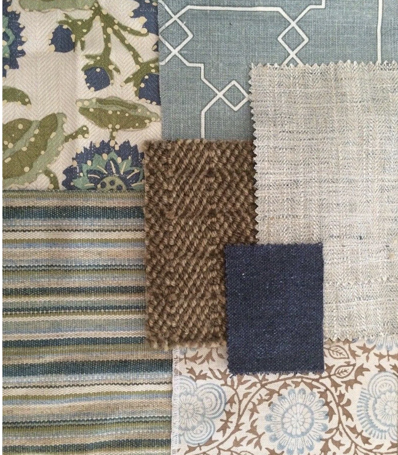 A collection of fabric samples with various patterns and textures, including floral, geometric, striped, and solid designs, arranged on a surface.