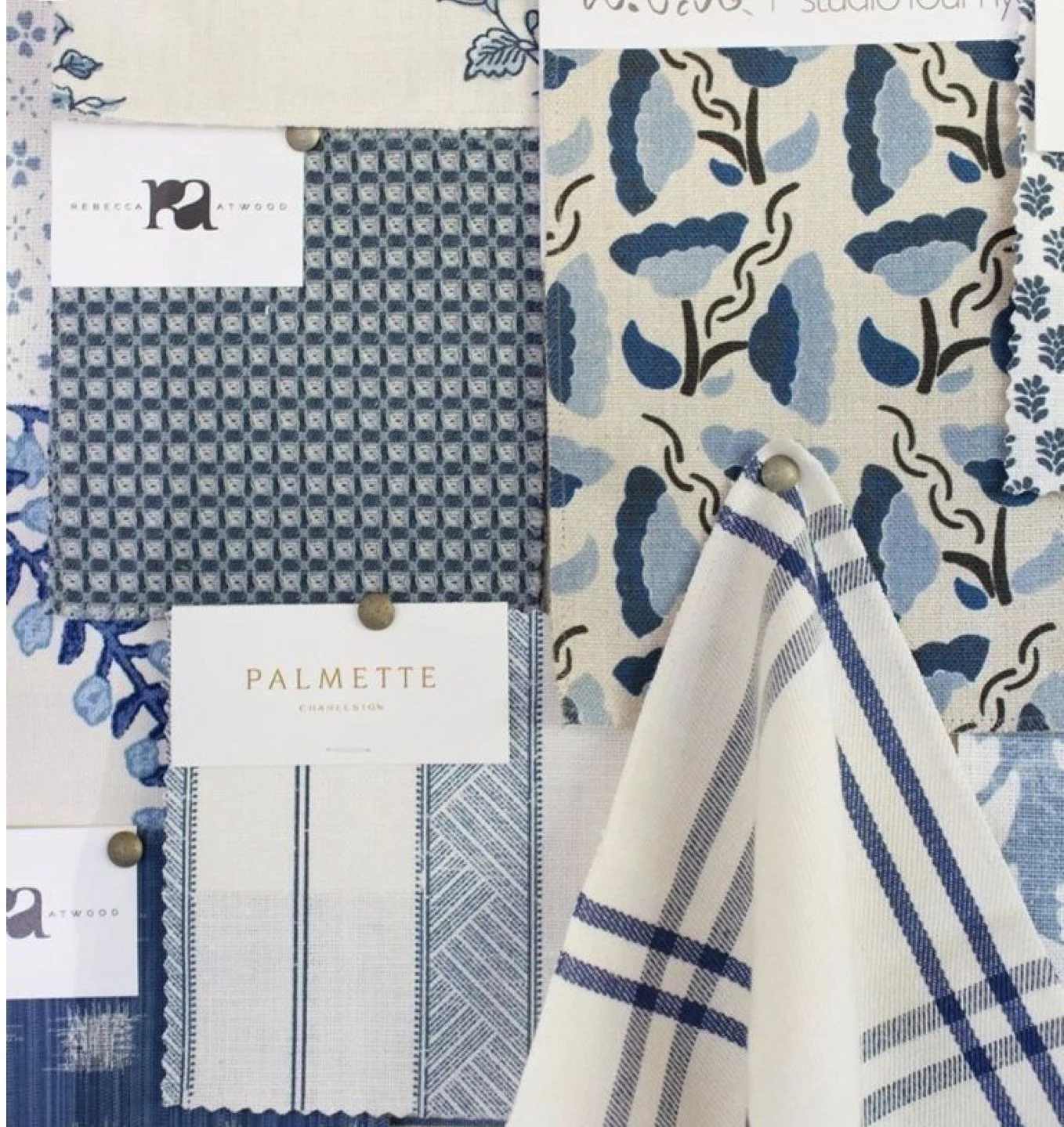 Display of various fabric swatches in blue and white patterns, pinned to a board with labels including 'REBECCA ATWOOD' and 'PALMETTE CHARLESTON.'