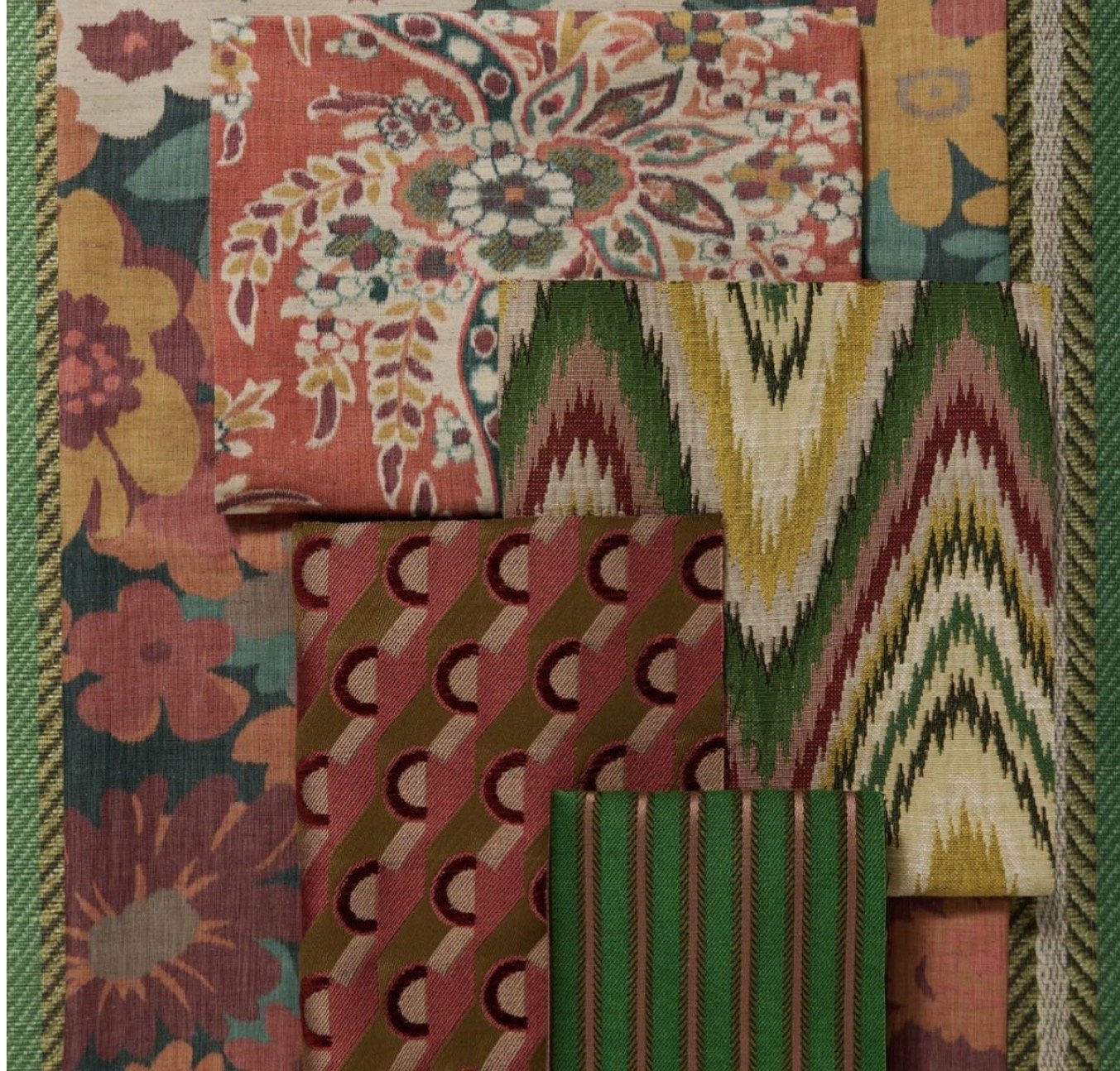 A collection of fabric pieces with various colorful patterns, including floral, geometric, and tribal designs, arranged in overlapping layers.