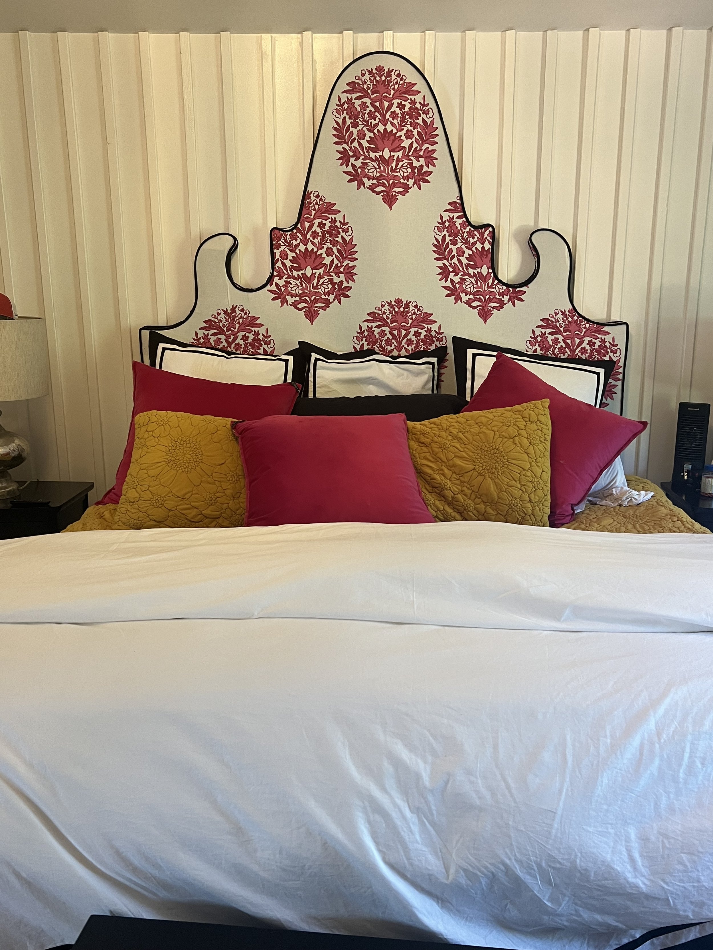 Pop of color in a white bedroom