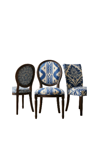 Three wooden chairs with upholstered seats and backs featuring blue and white patterns, arranged in a row against a white background.