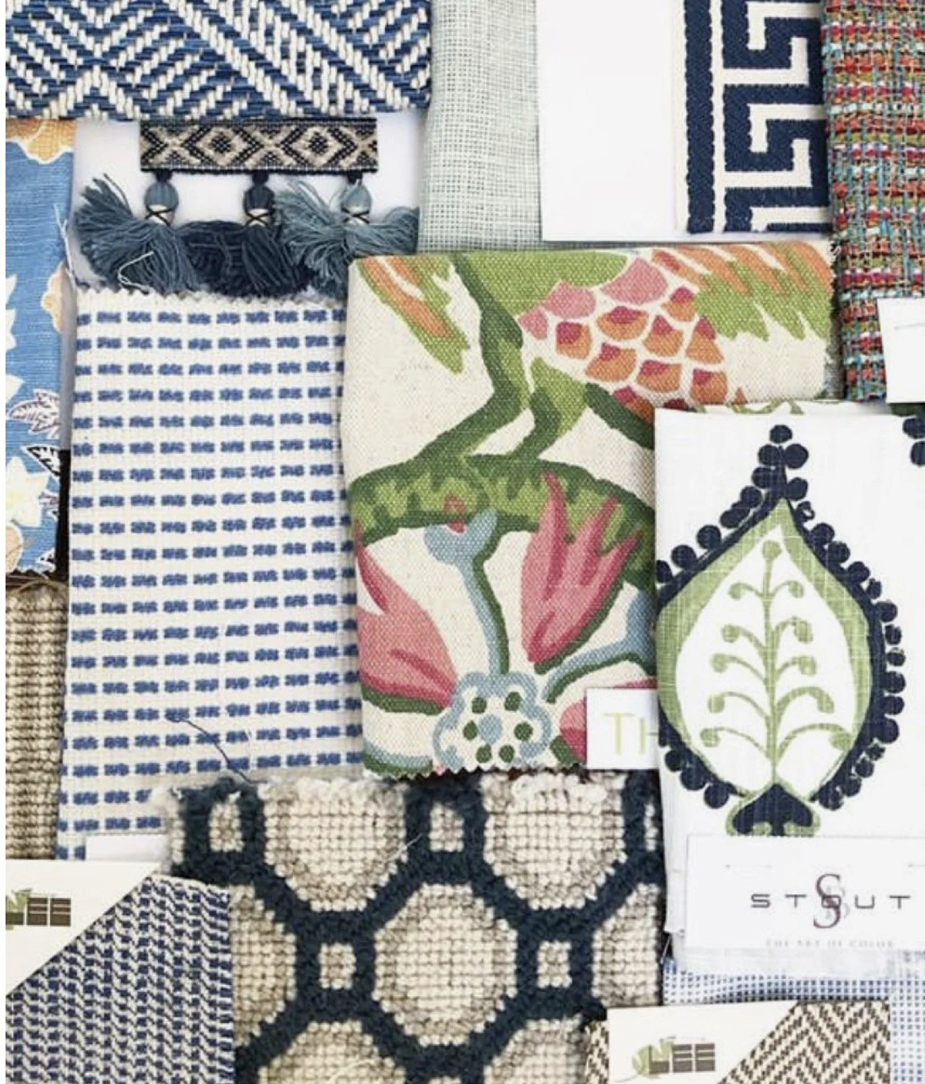 A collection of various fabric and textile samples with different patterns, colors, and textures, including floral, geometric, and traditional designs.