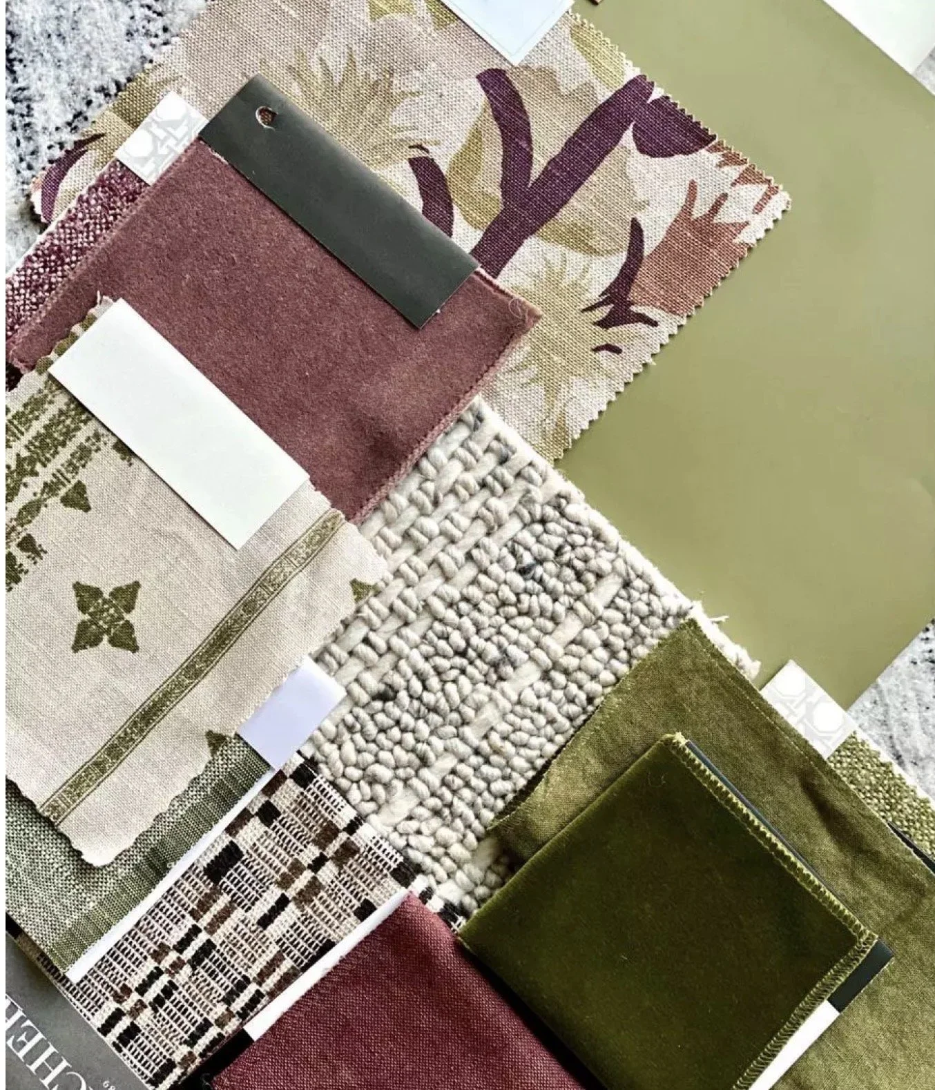 Sample of various fabric swatches including patterned, textured, solid, and woven materials in multiple colors such as red, green, beige, and cream.