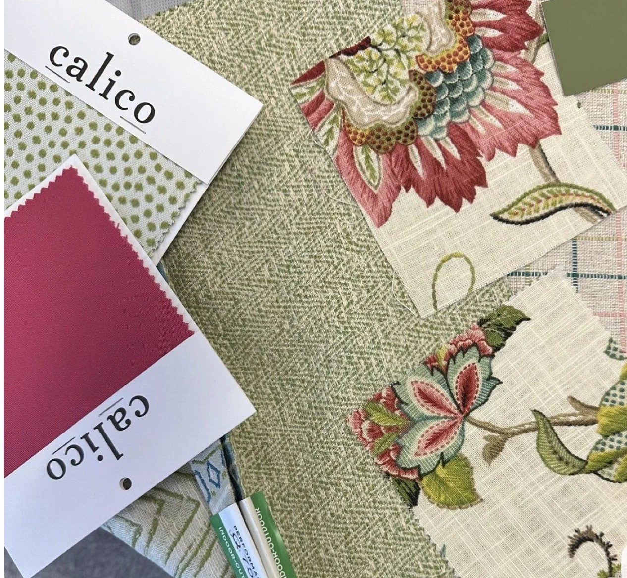Fabric swatches with floral and geometric patterns, Calico and Calico color samples, and a green textured fabric.