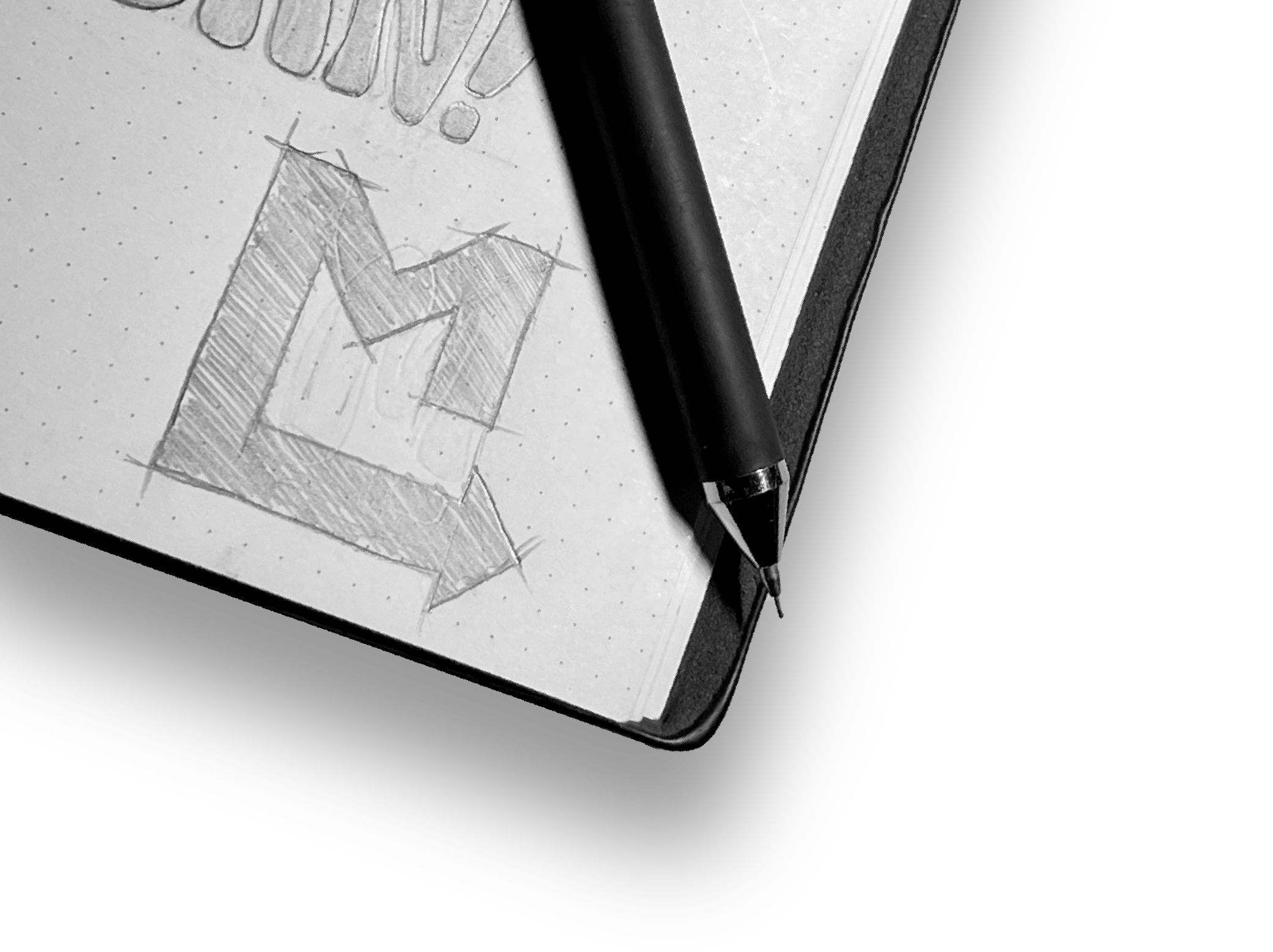 Drawing of a 3D block letter 'E' on dotted paper with a black pen resting diagonally on the paper.