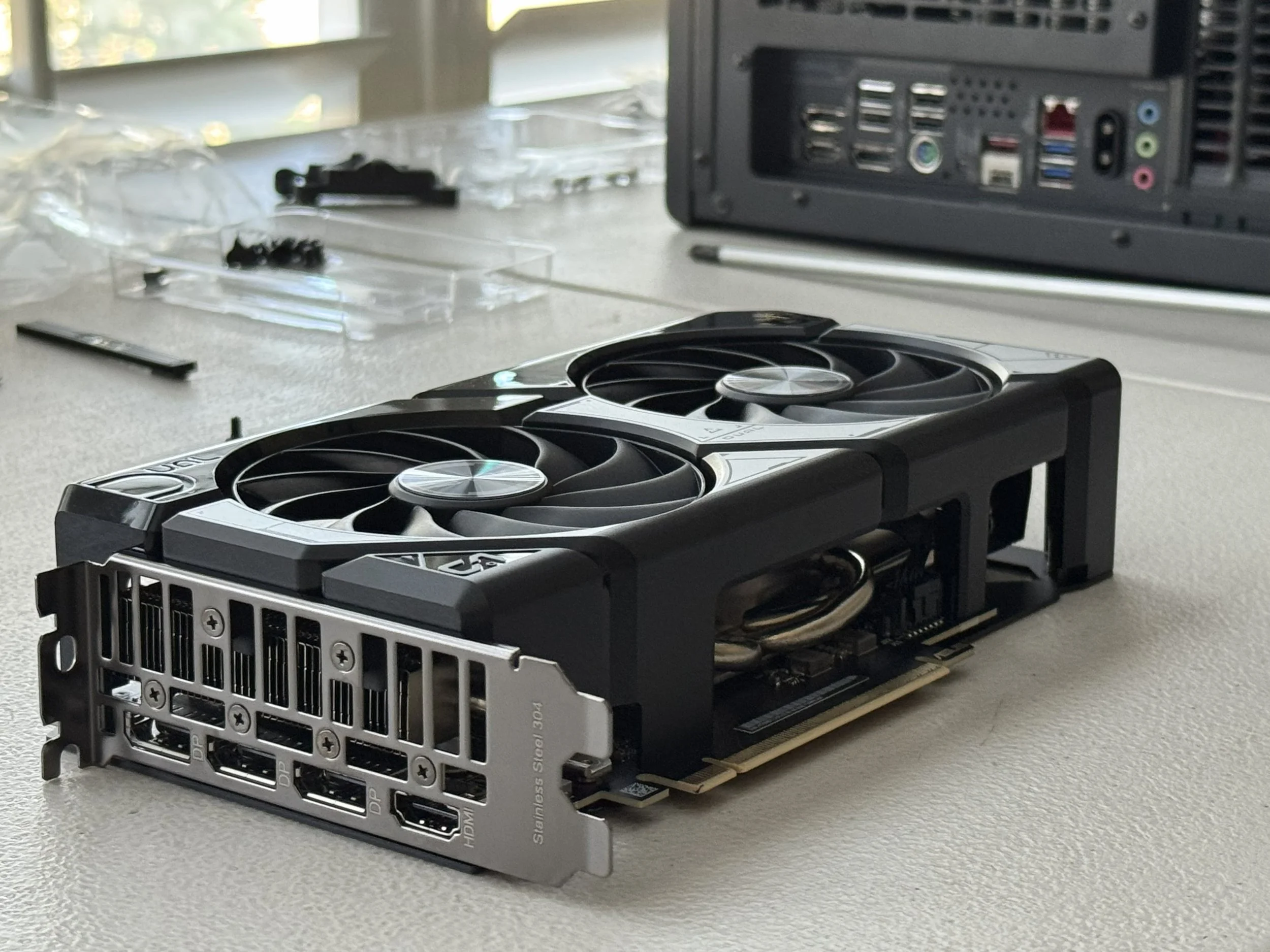 Zenith PC workbench setup in San Antonio, showing an RTX 5060 Ti, precision tools, and hardware ready for hand-assembly.