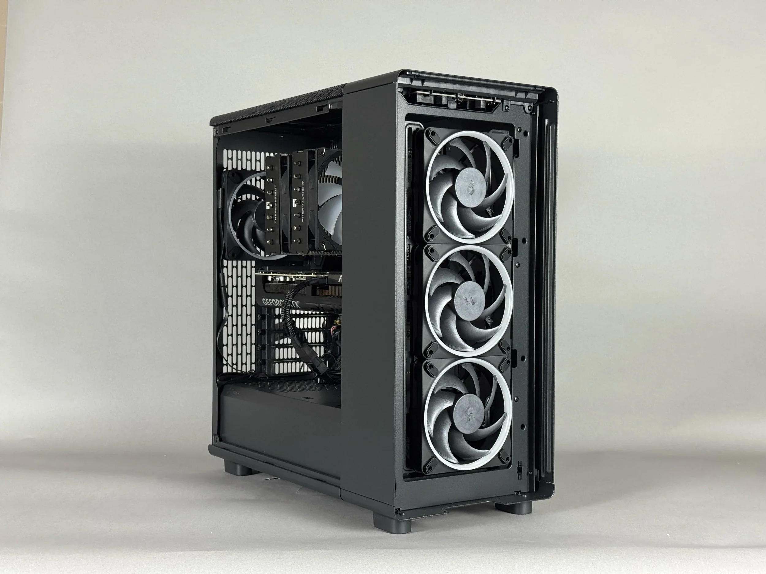 The Zenith Z3's demonstrating its Fractal Epoch case with it's mesh removed, showing off it's 3 Fractal Momentum fan intake, Phantom Spirit EVO CPU Cooler, and 1 Fractal Momentum exhaust set up.