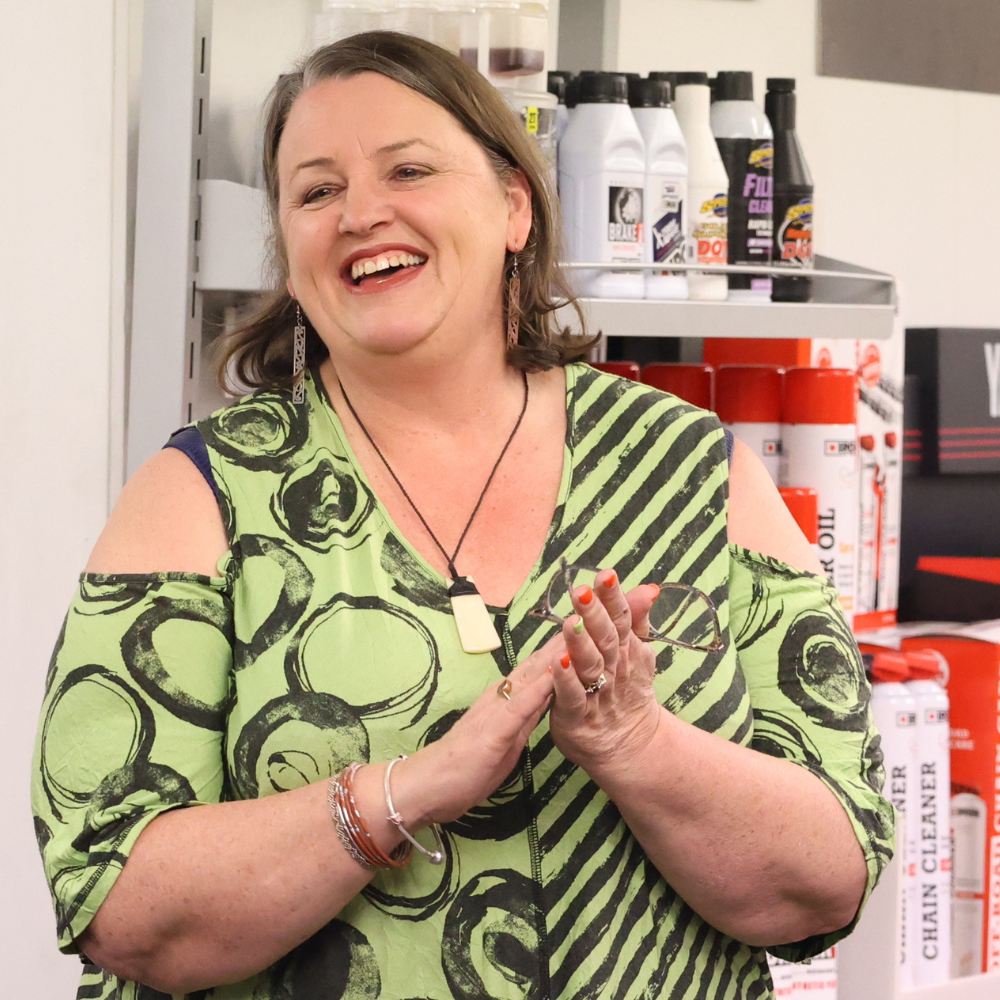 Angela smiling and clapping