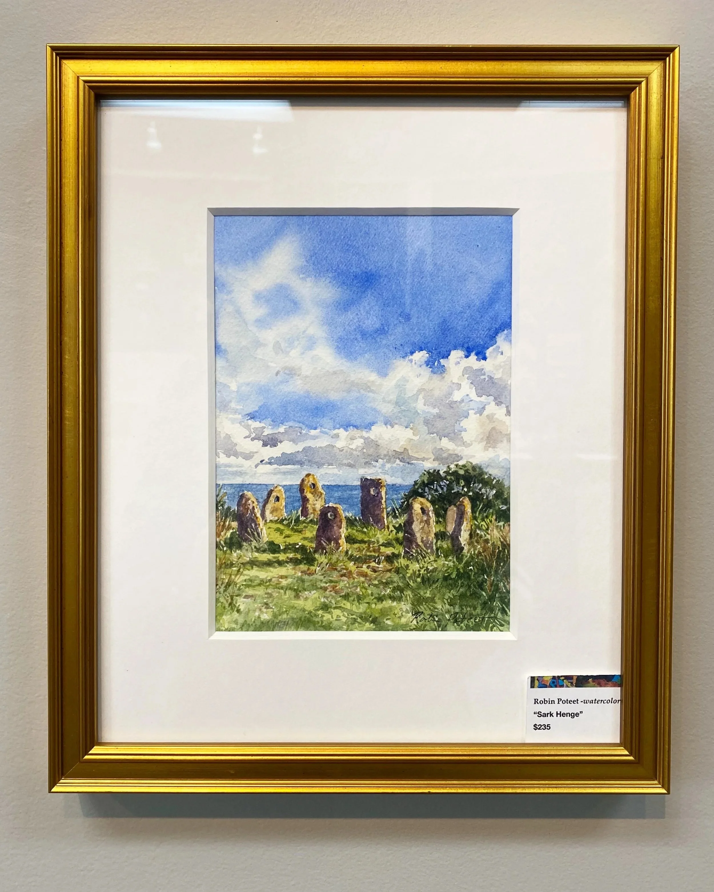 Watercolor painting titled 'Sark Henge' by Robin Poteet, priced at $235, depicts ancient stone structures on a grassy hill with a blue sky and clouds.
