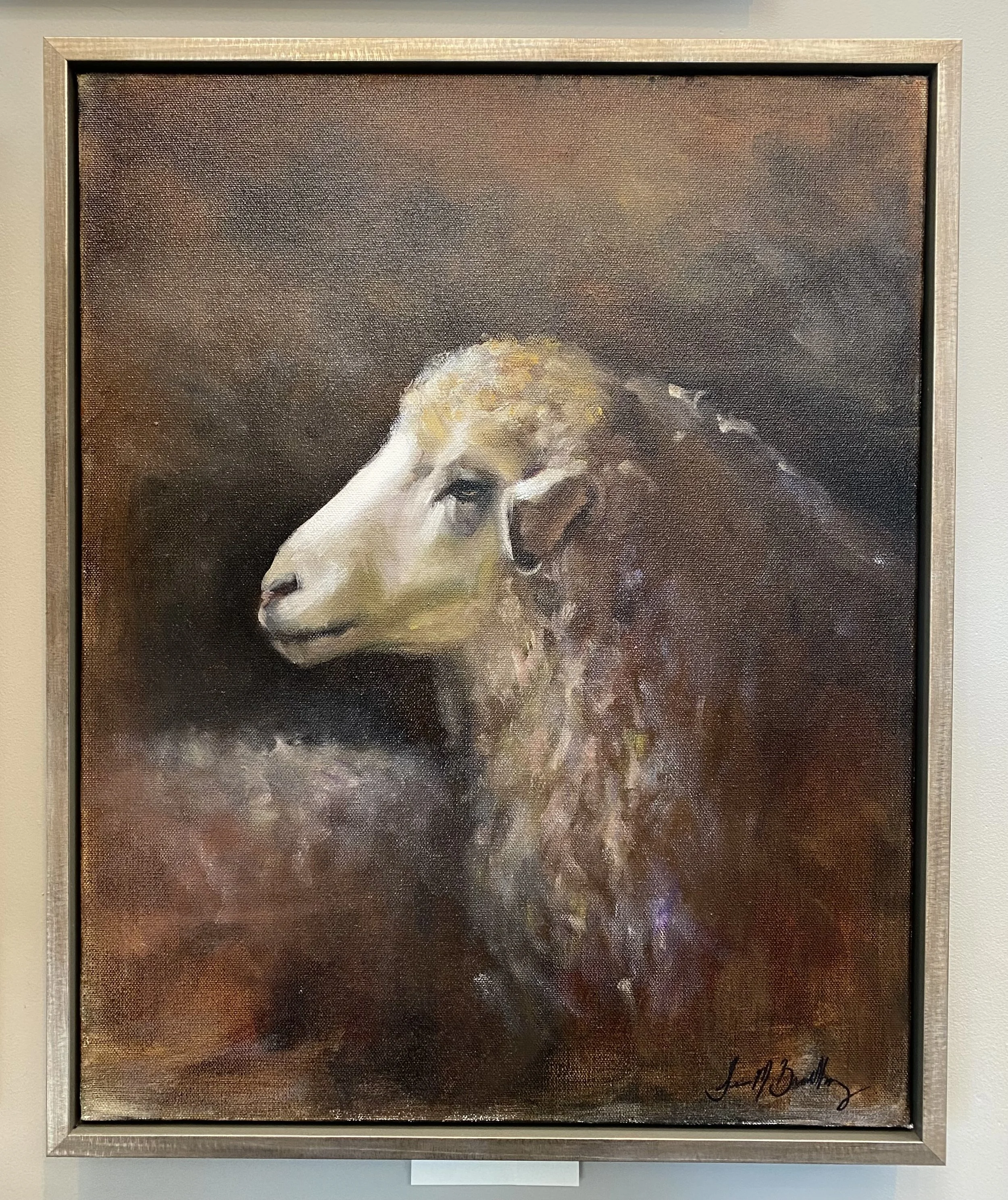 Oil painting of a sheep's profile with a dark, abstract background.