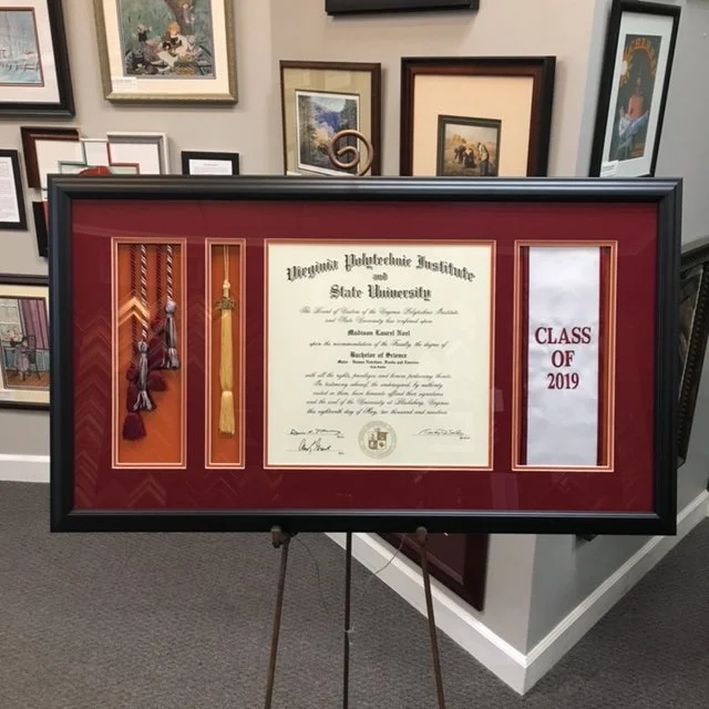 Framed graduation certificate from Oregon Polytechnic Institute and State University for the class of 2019, with tassels and cords displayed on the left side.
