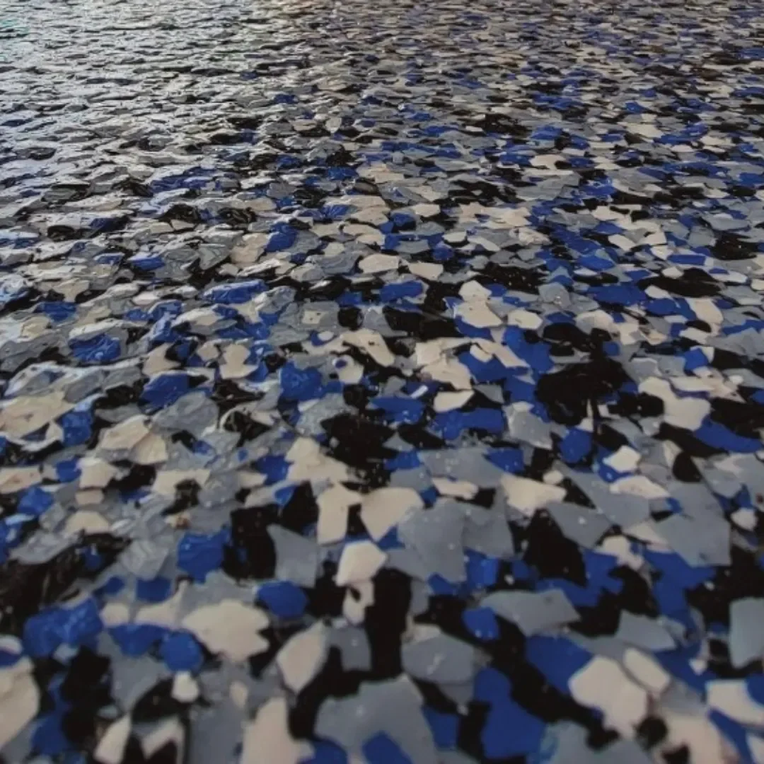 Blue flake epoxy floor with durable decorative surface.
