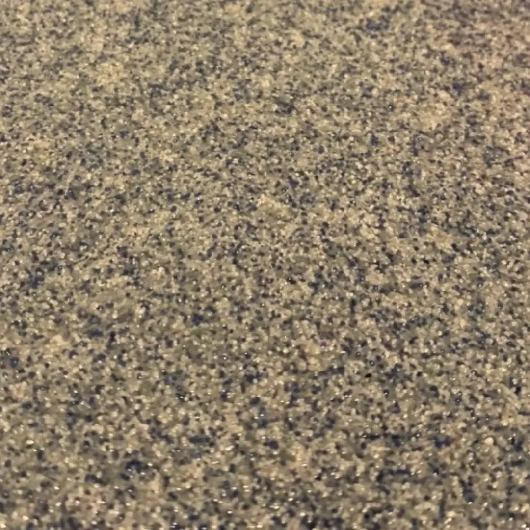Close-up of sandy beach surface with numerous small sand grains.