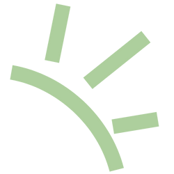 Close-up of a green spoked wheel or gear with a part of its curved edge and spokes visible