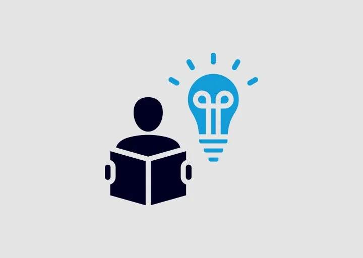 Icon of a person reading a book with a light bulb above their head, indicating an idea or realization.