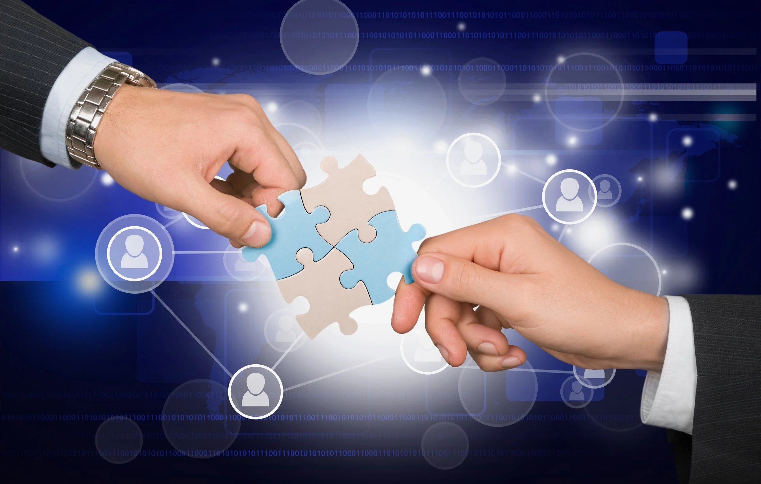 Organistional Support illustrated by two people in business suits fitting together puzzle pieces.