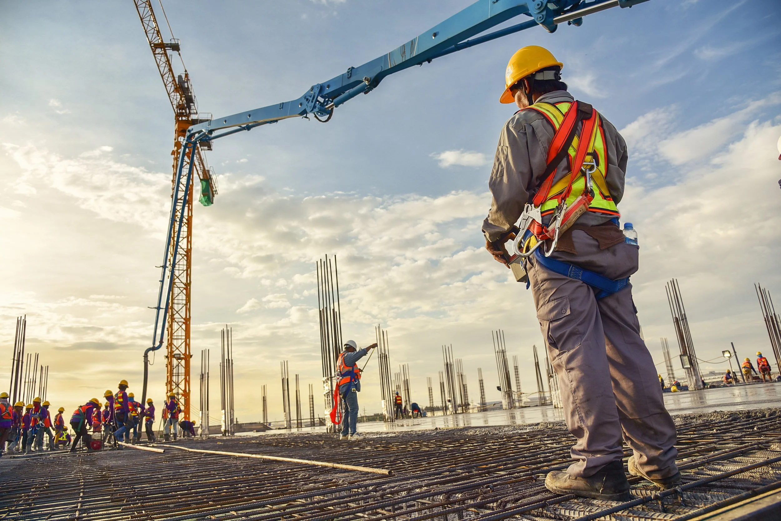 Construction workers on the roof of a building