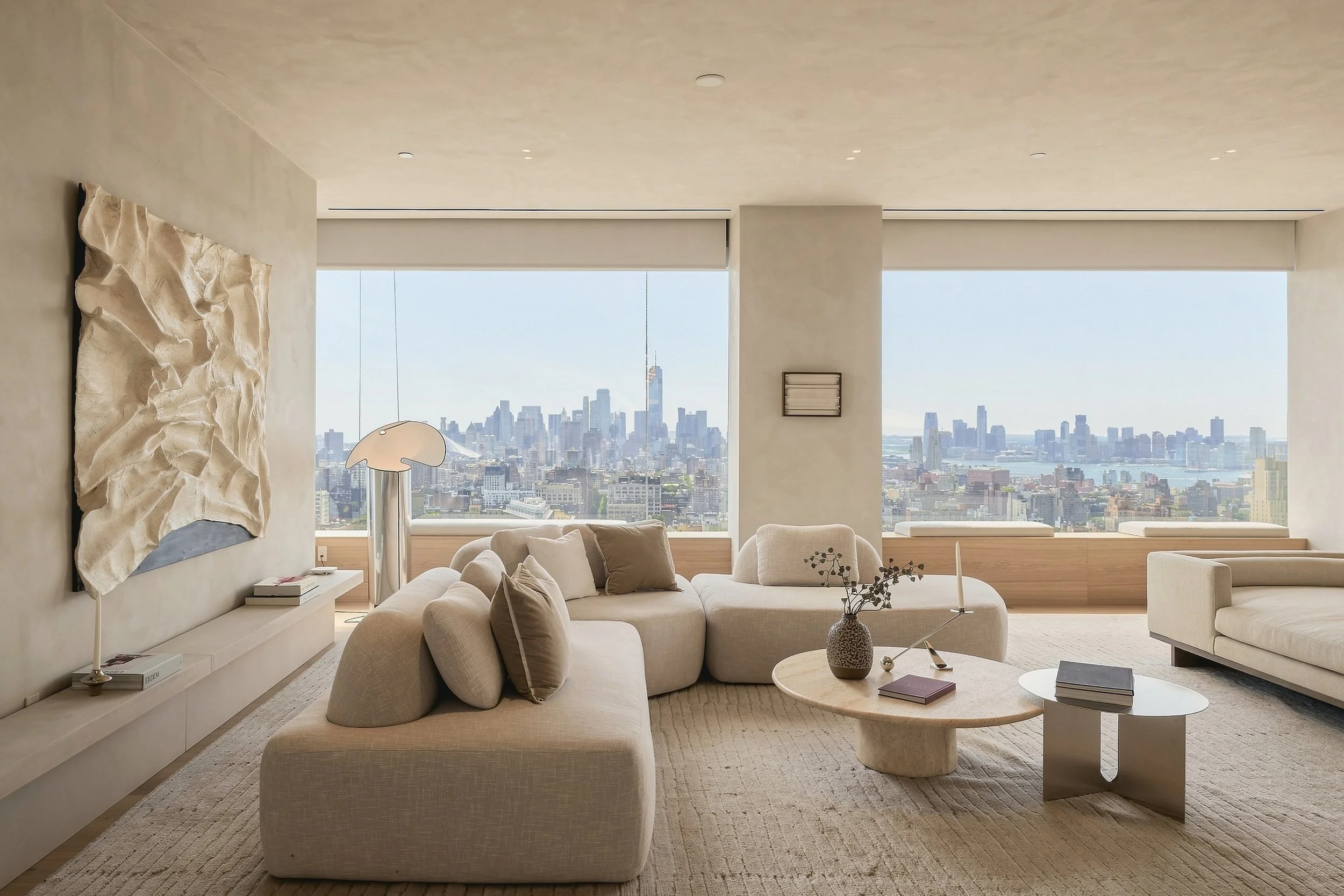Penthouse living room with skyline views and a modular sofa