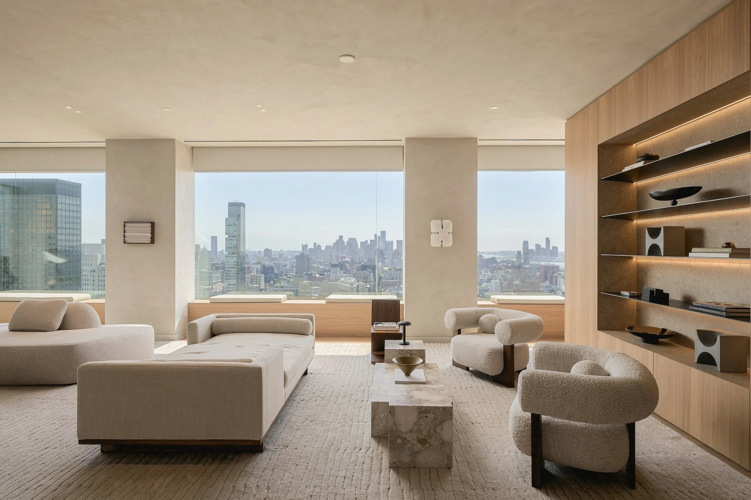 Great room with oak shelving wall and panoramic city windows