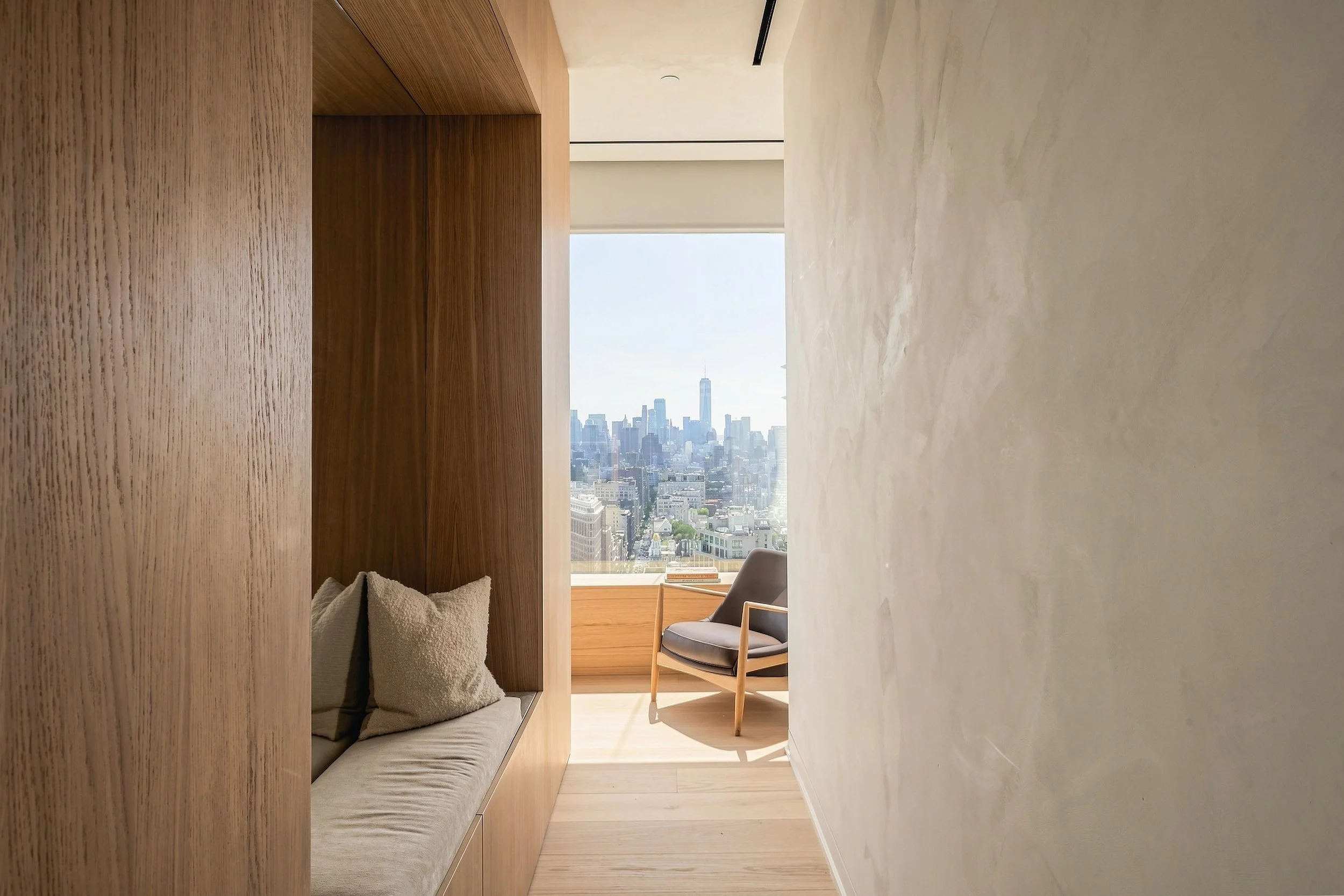 Oak window seat reading nook with city views