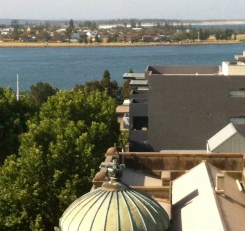 The view across Newcastle Harbour from an upper-floor suite