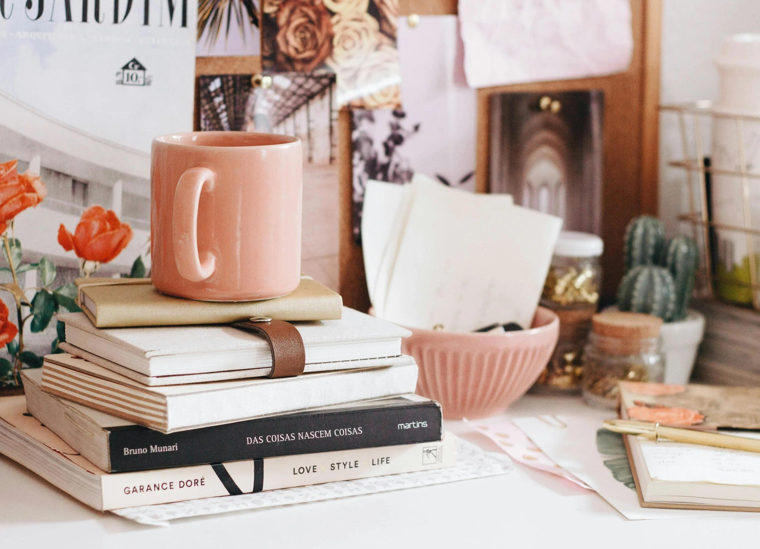 aesthetic office with coffee mug, books, journals, and office supplies