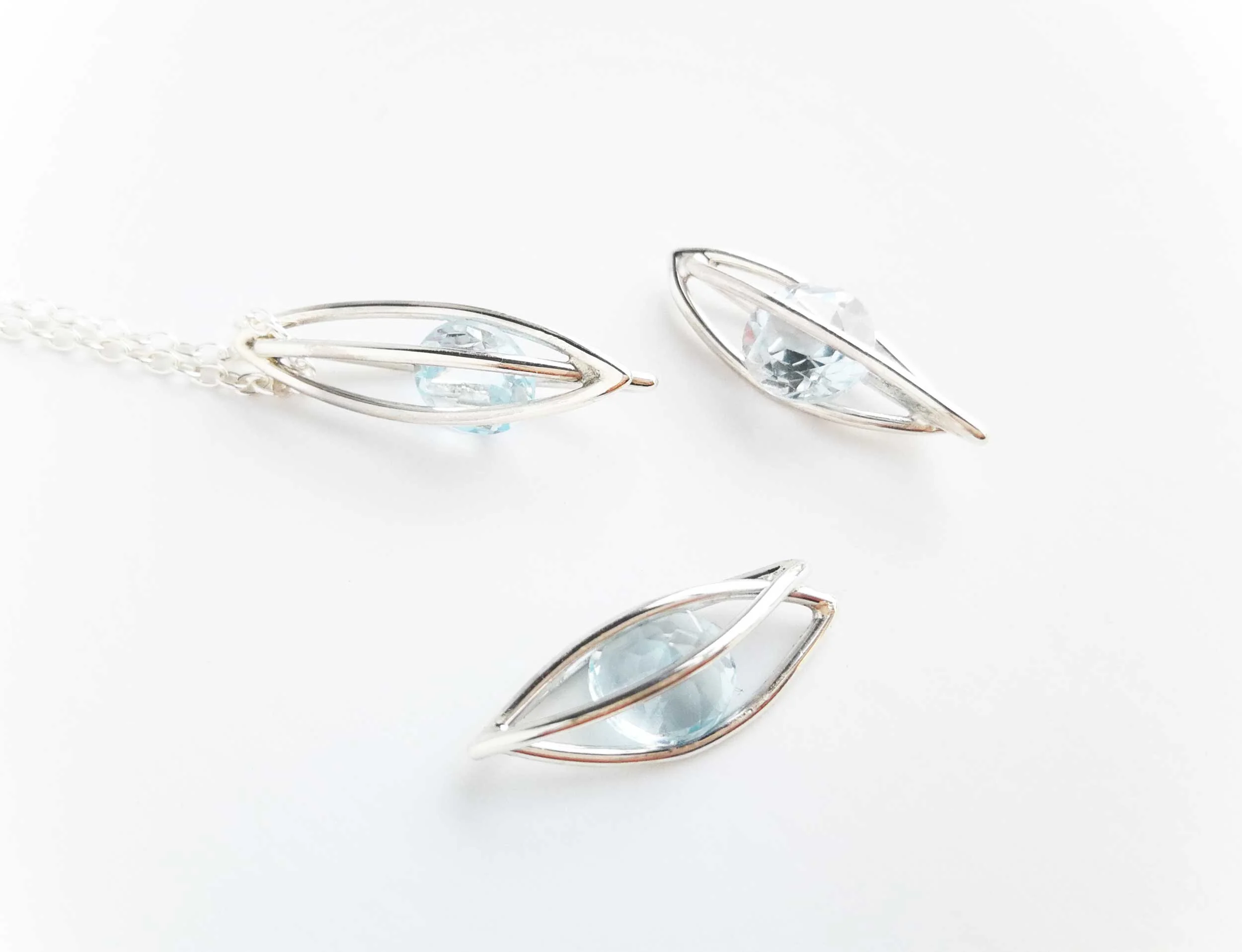unique designer jewellery blue topaz and sterling silver necklace white background