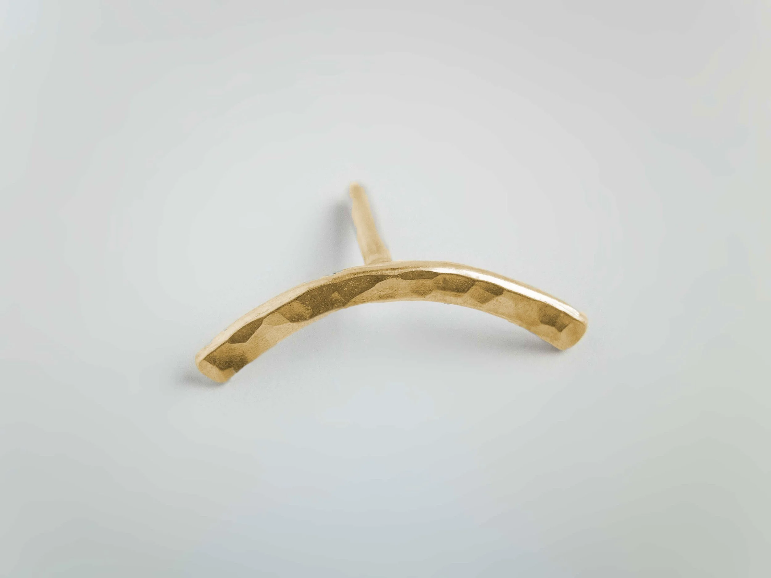 handmade solid 9ct gold conch earring white background