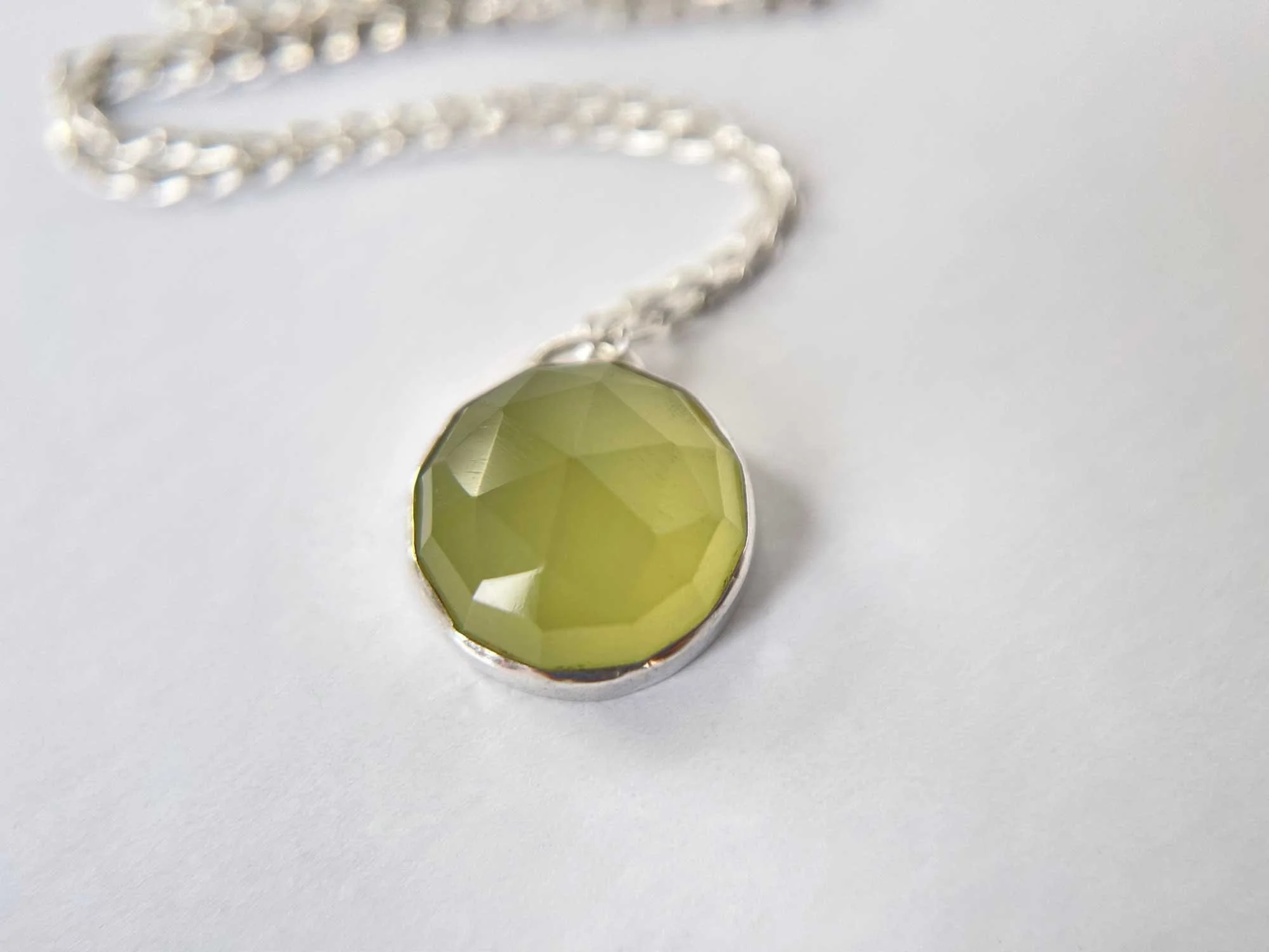 handmade rose cut chalcedony necklace on white background