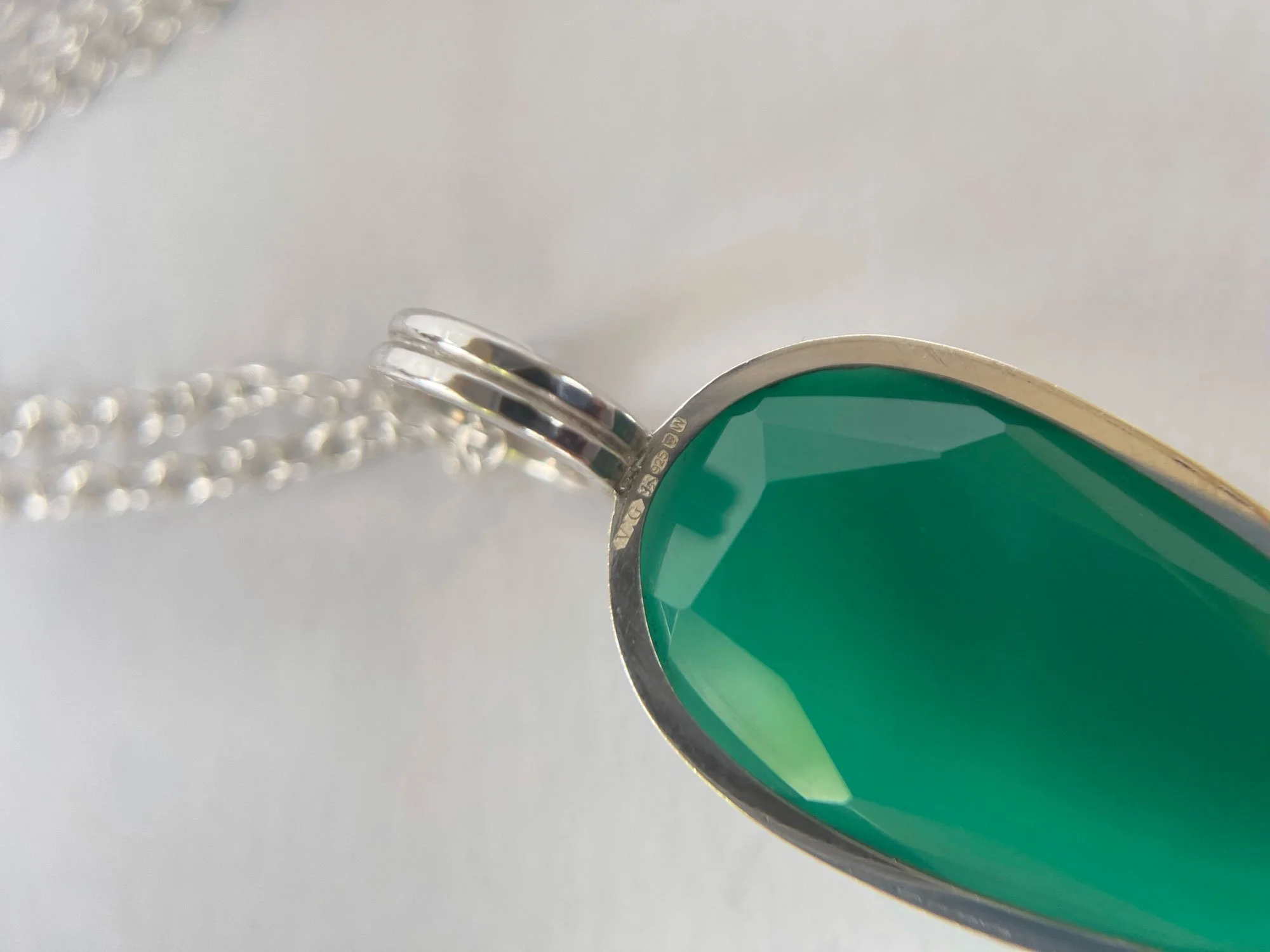 london assay office hallmark on green onyx and silver pendant
