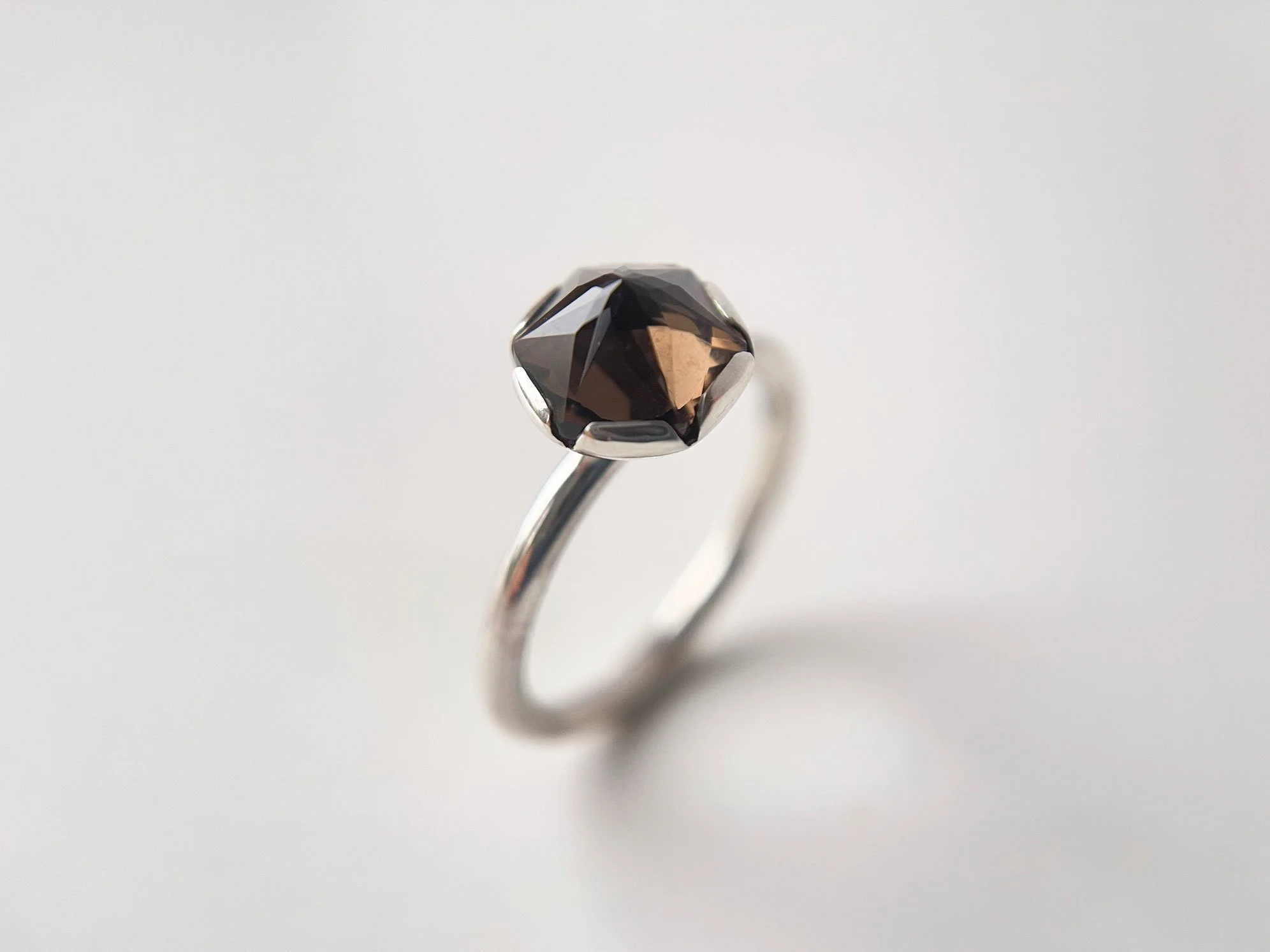 handmade smoky quartz ring with inverted setting white background