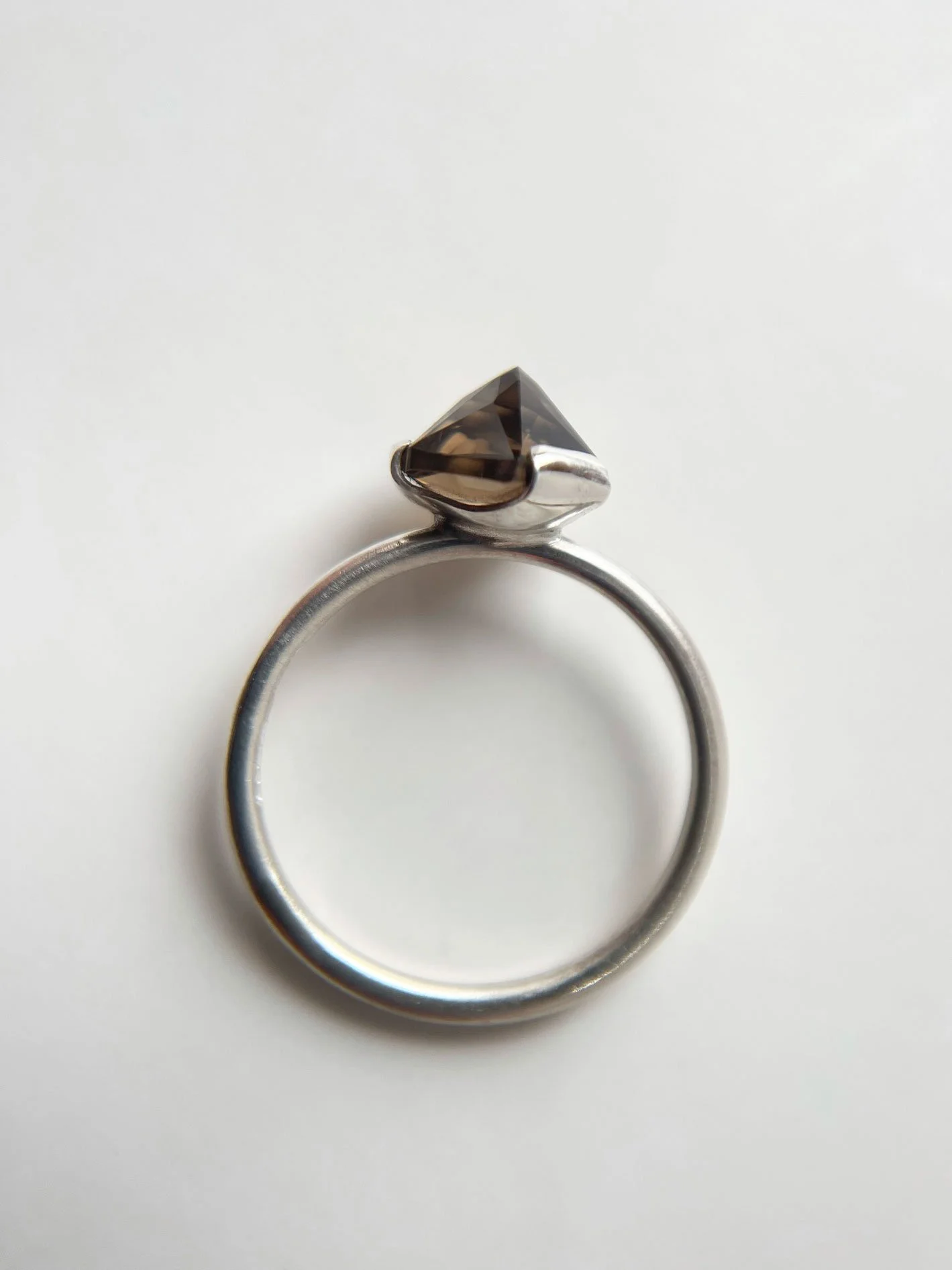 side view smoky quartz ring one of a kind white background
