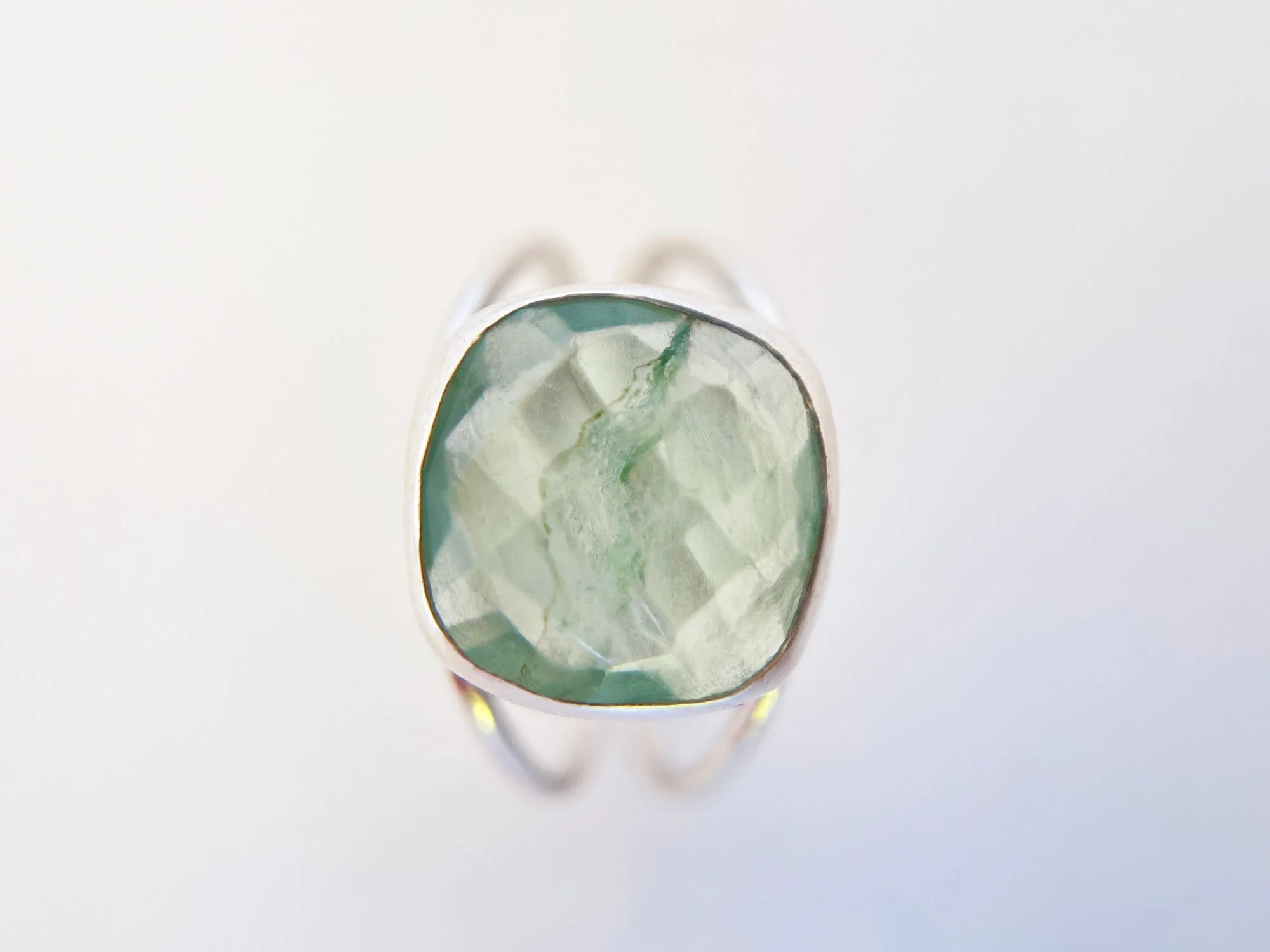 green flourite and silver ring top view white background
