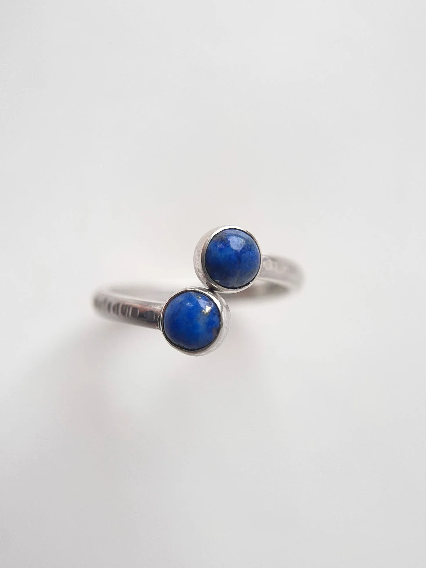 double ended turquoise and silver ring white background