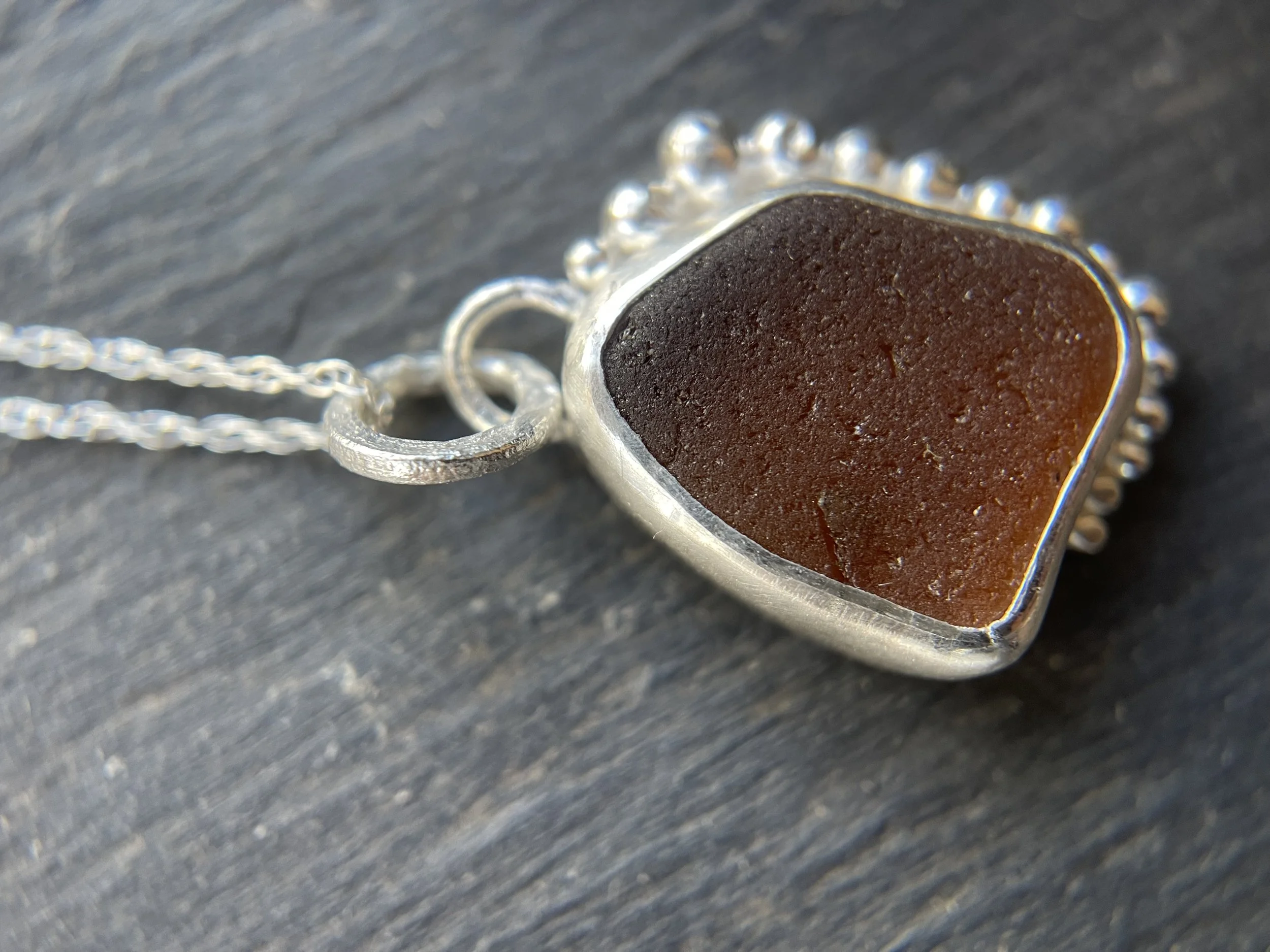 One of a kind natural seaglass pendant grey background