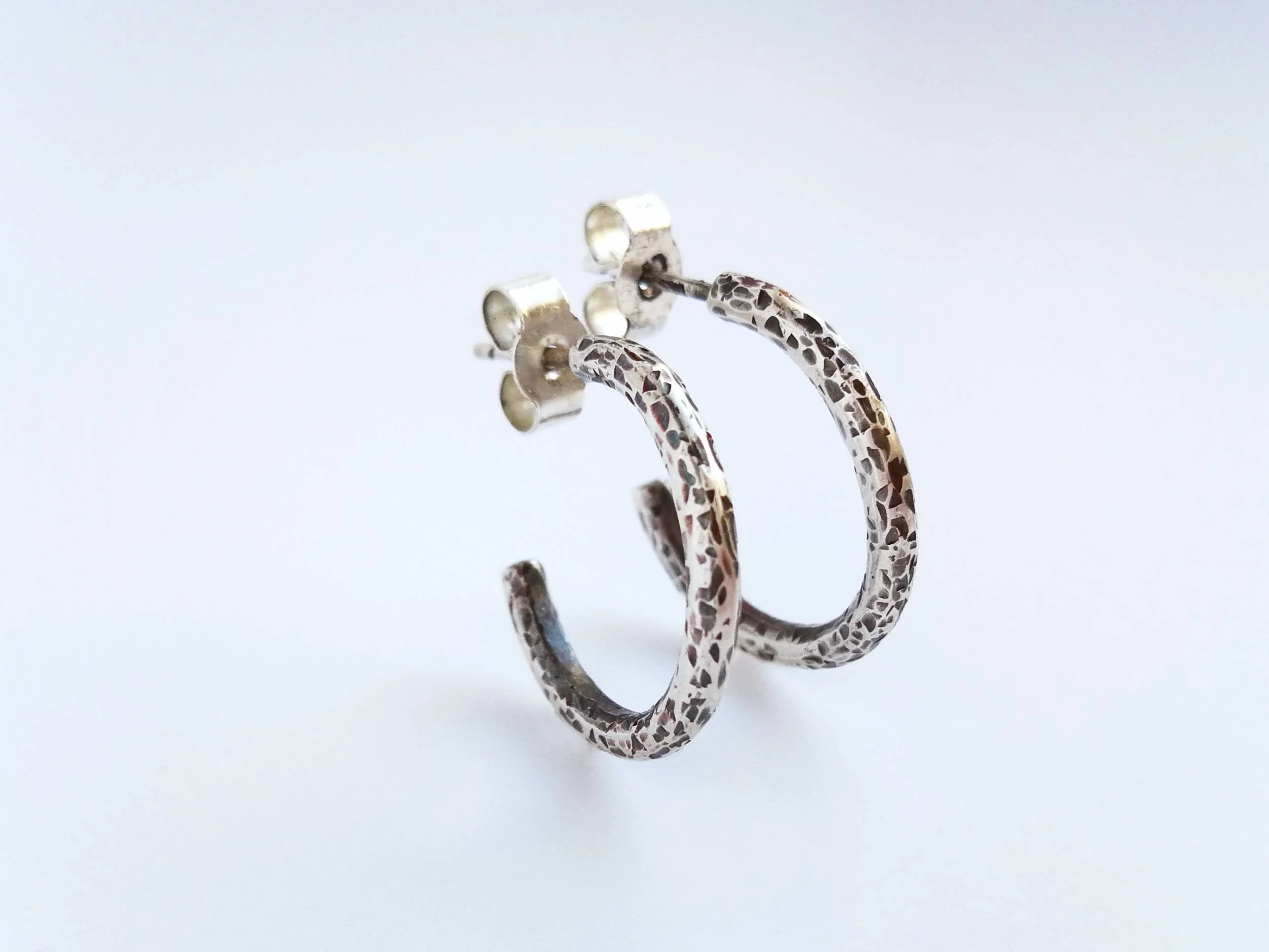 Oxidised textured hoop earrings handmade on white background