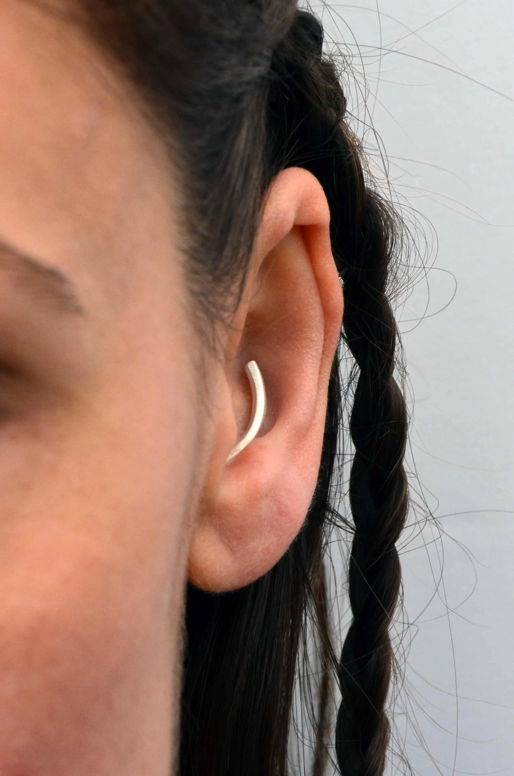 Minimalist silver conch jewelry handmade recycled silver on model