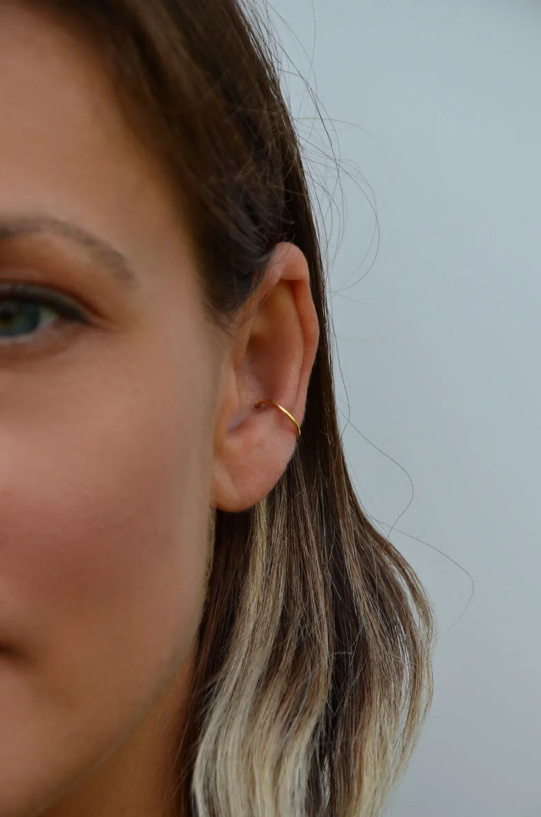 14ct Solid gold conch earring on model